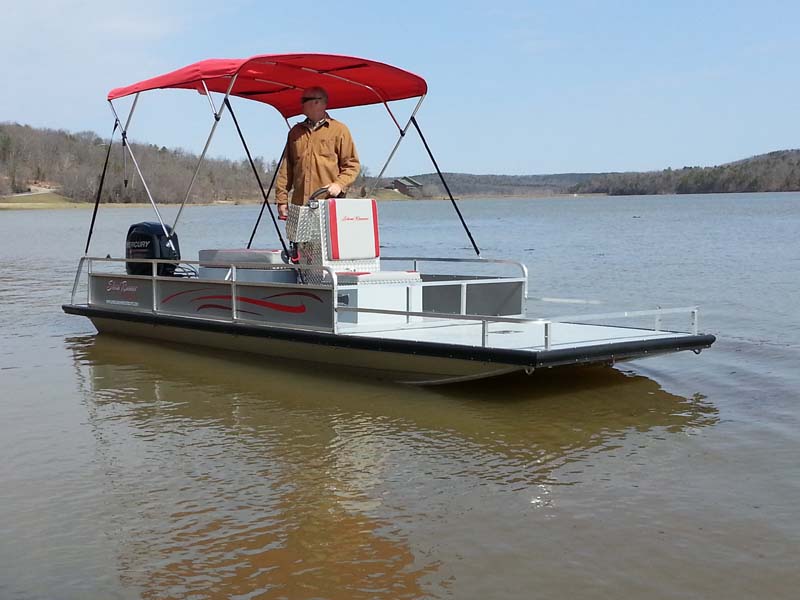 silver flat bottom boat with red cover