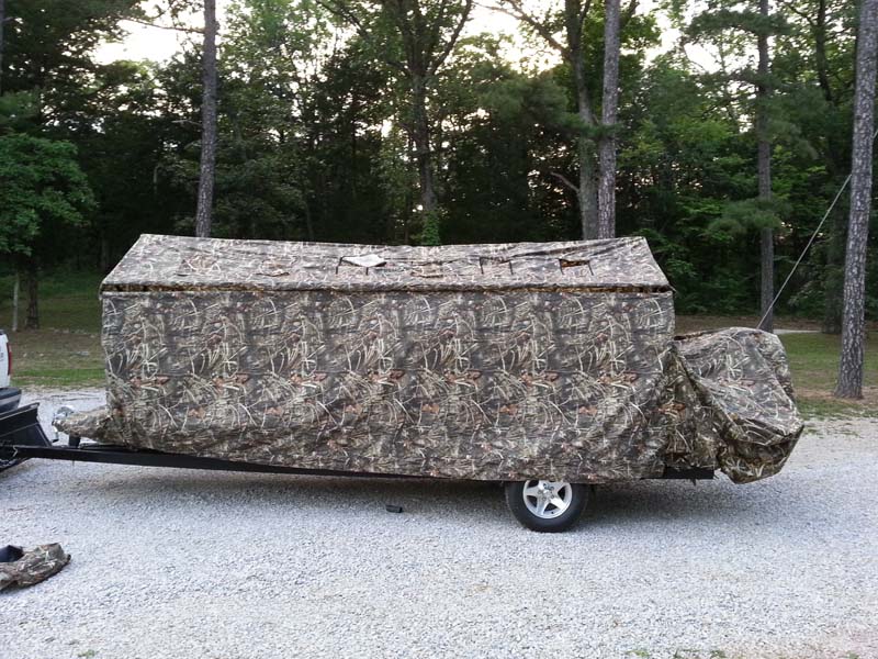 camouflage cover over boat side view
