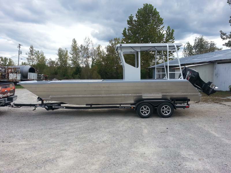 silver boat on trailer side view