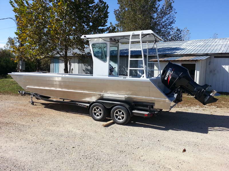 silver boat on trailer side view
