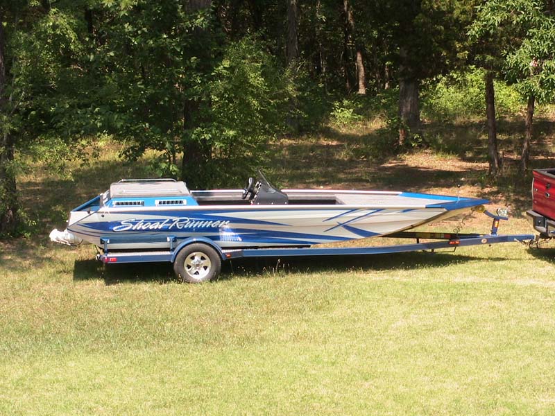 shoal runner blue and gray boat side view